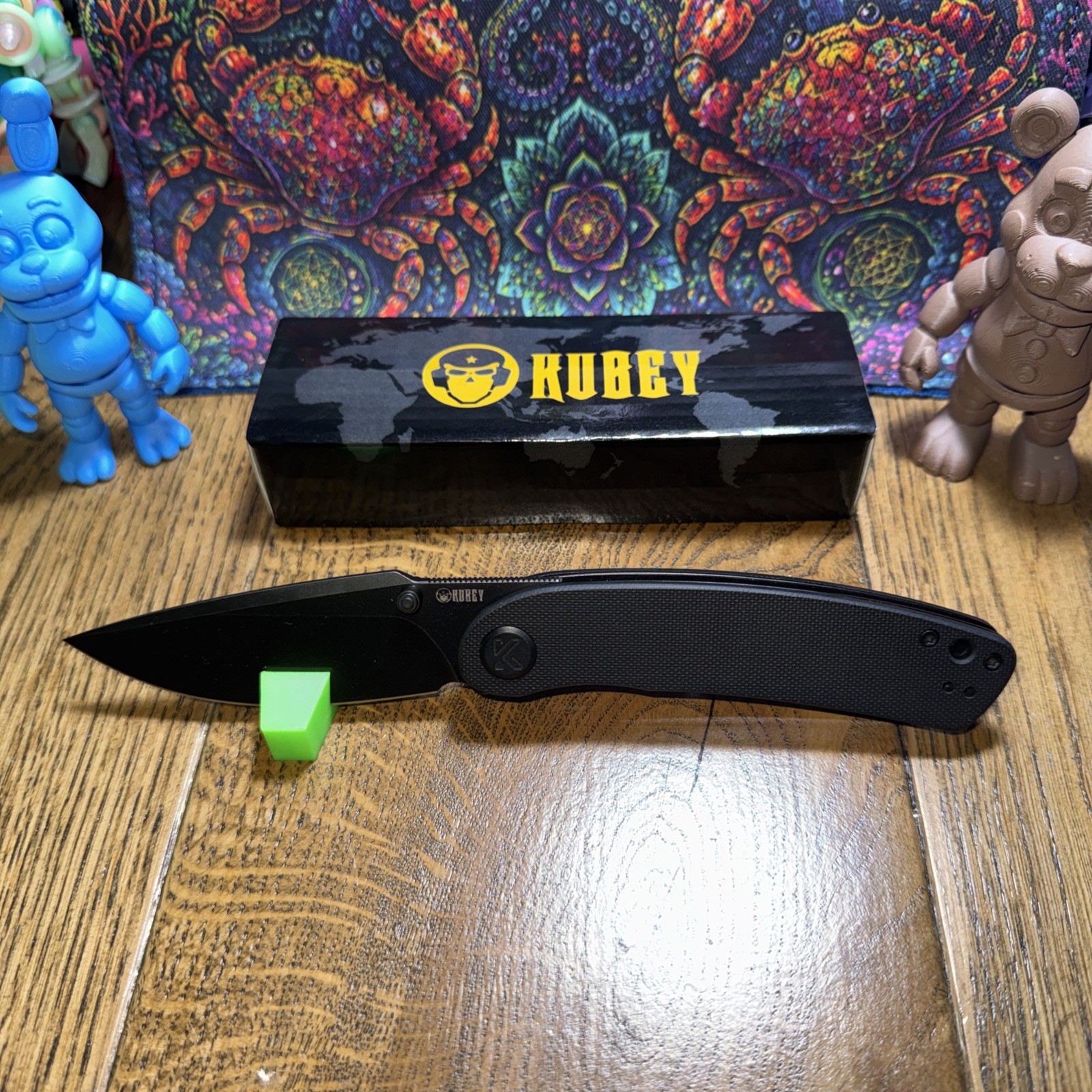 Kubey Momentum KU344E. D2 Blade. G10 Handle. Front Flip. Thumb Stud. Liner Lock.