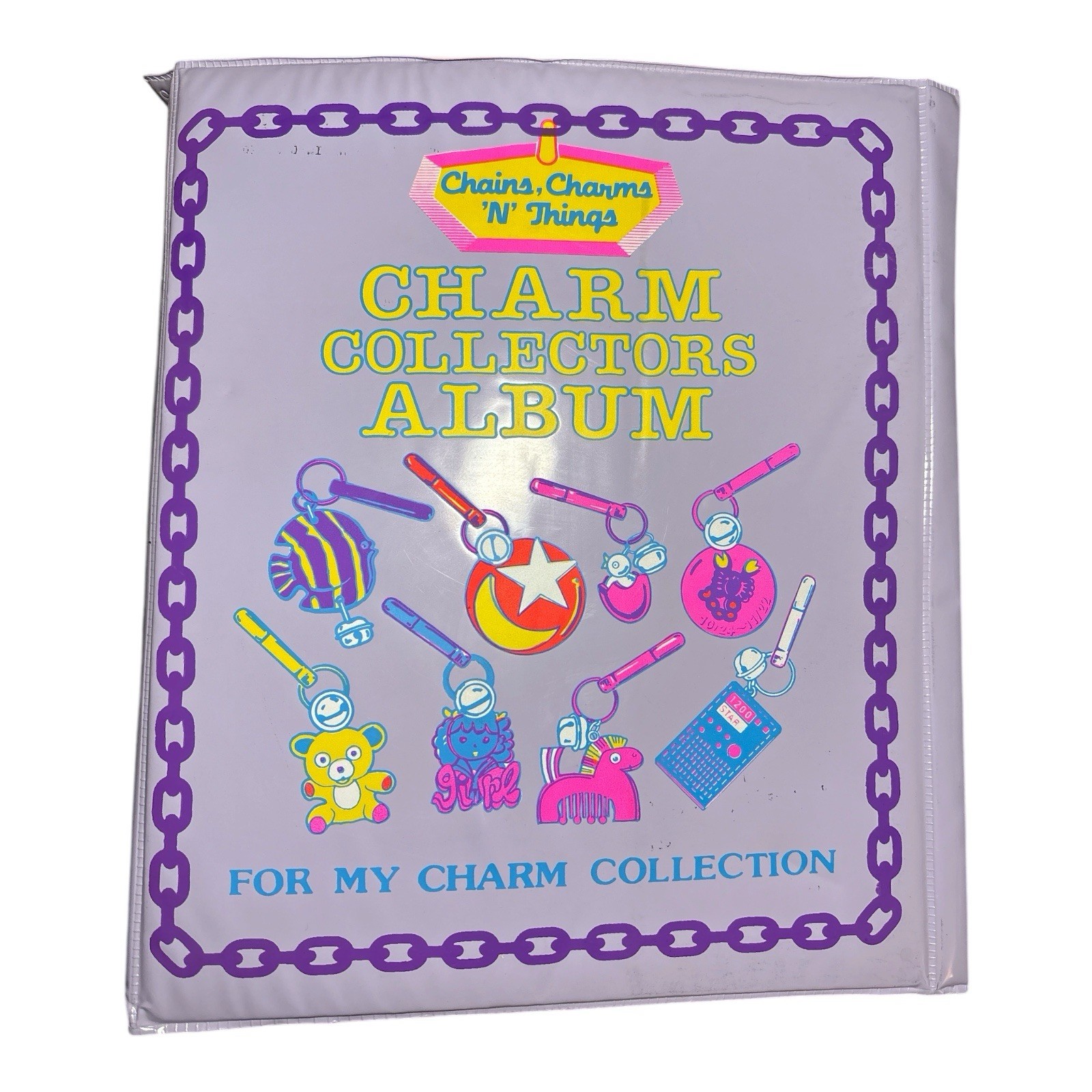 Vtg. 1985 Imperial 31 Charms 2 Chains Purple Collectors Album Bell Charms