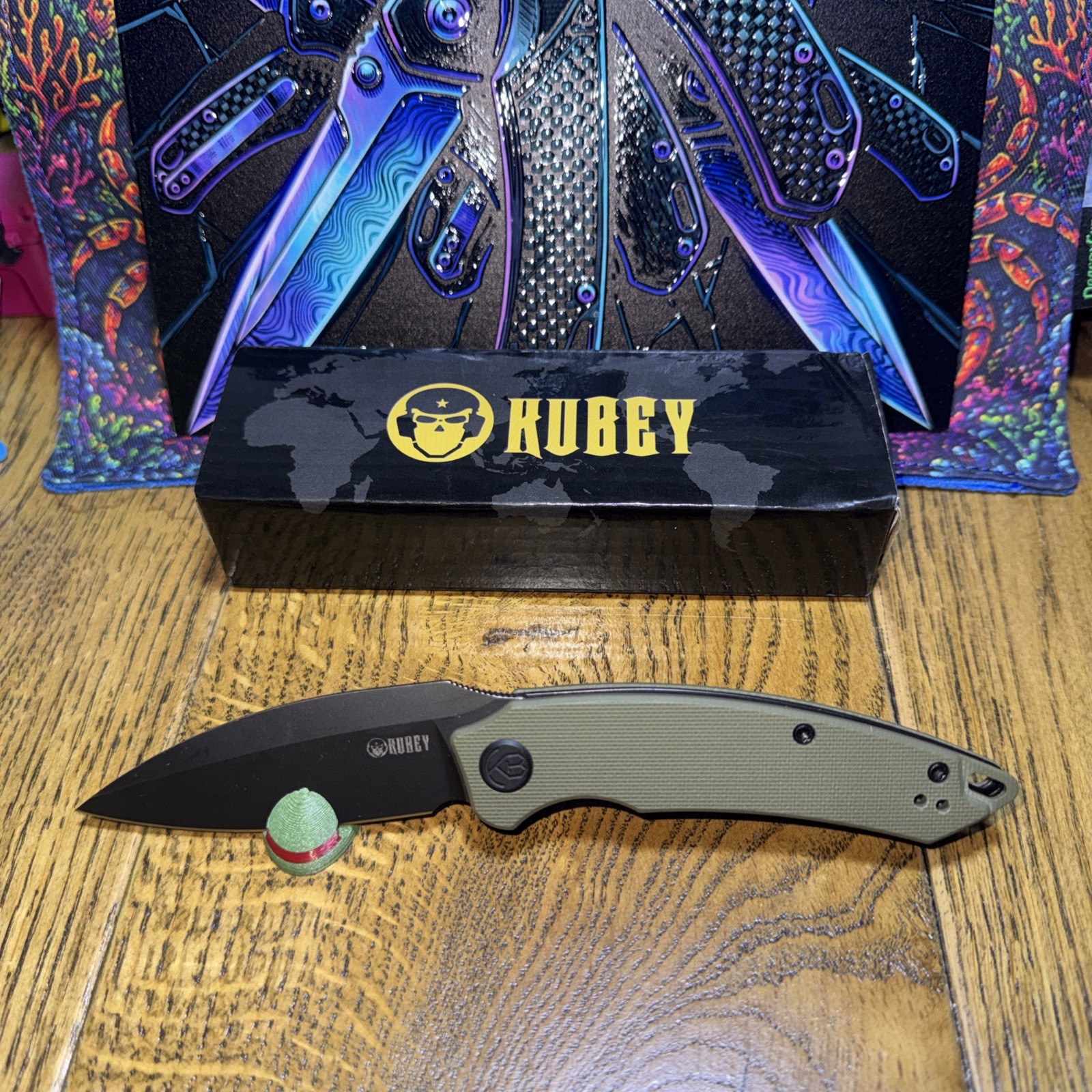 Kubey Leaf KU333C. Green G10 Handle Black AUS-10 Blade. Top Roll. Liner Lock.