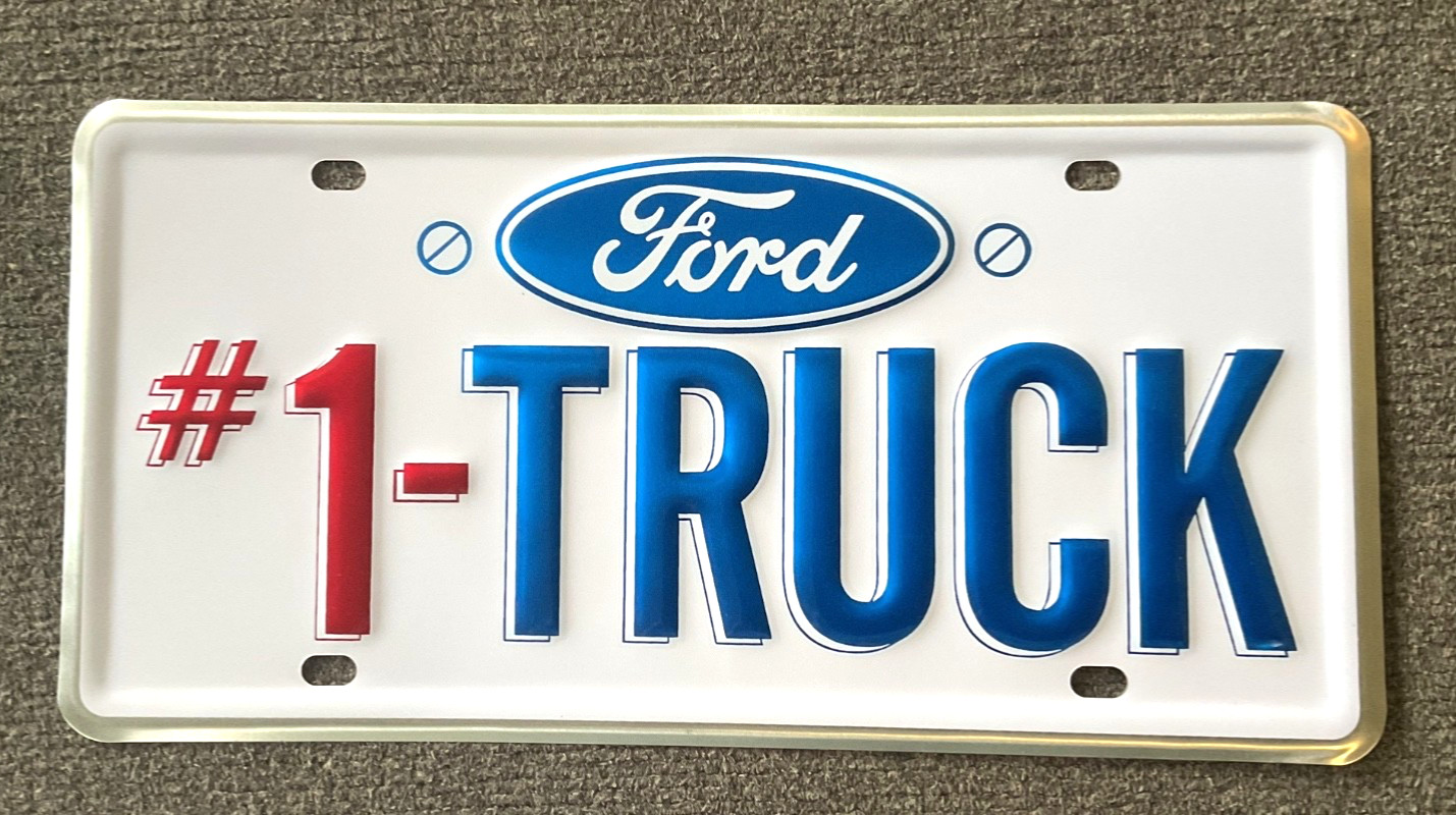 RARE VINTAGE FORD #1 TRUCK DEALERSHIP BOOSTER LICENSE PLATE ORIGINAL UNUSED 