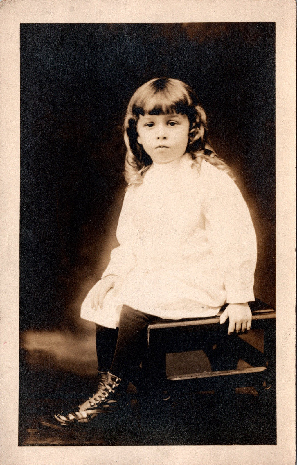 Postcard Real Photo RPPC Young Girl wearing Boots Sitting on Chair Unposted