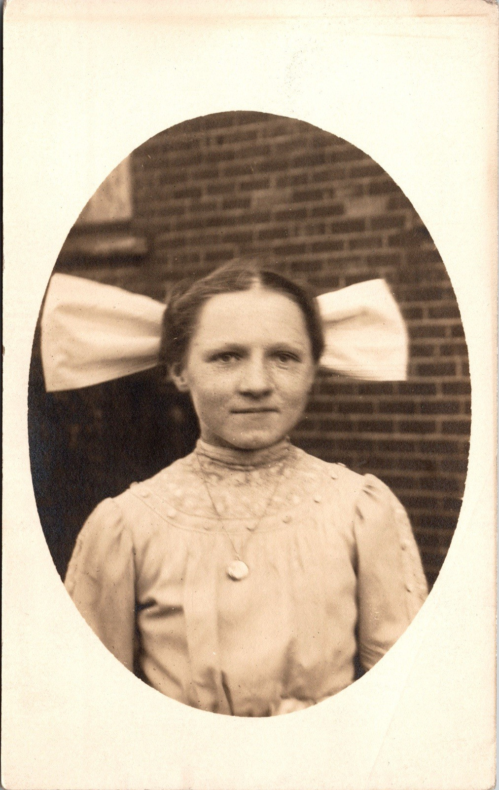 Postcard Real Photo RPPC Girl Wearing Large Hair Bow Wearing Pendant Unposted