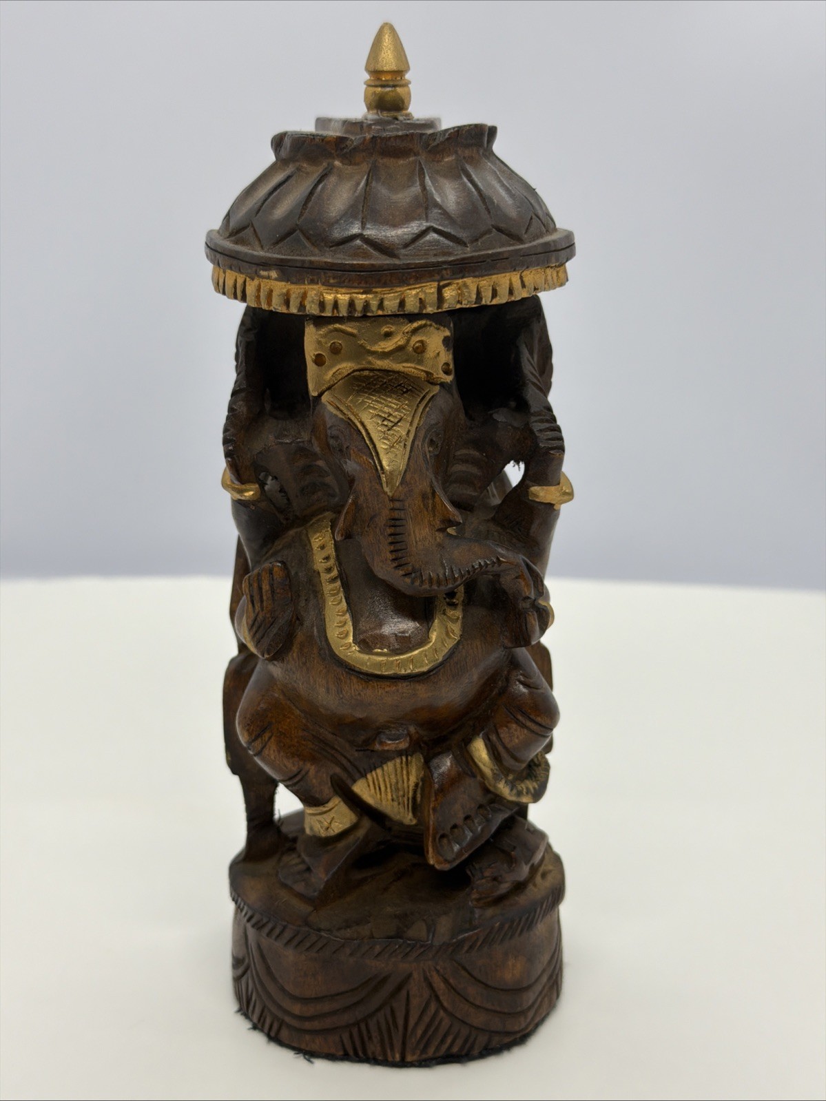 Vintage wooden Lord Ganesha idols umbrella and gold accents