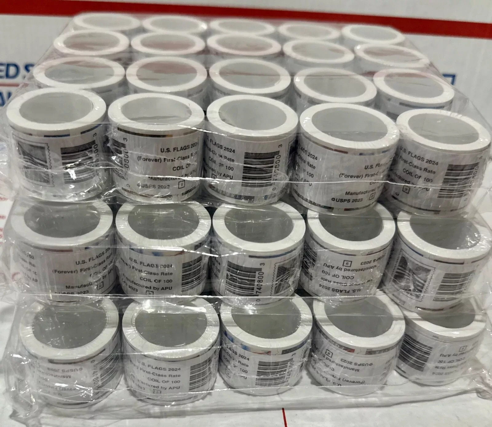 5 rolls of 100 USPS postage stamps, totaling 500 pieces