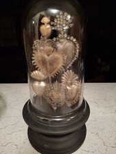 Reproduction Milagros On Black STAND With Glass Dome picture