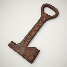 Dixie Hammer & Ax Cast Iron Bottle Opener picture