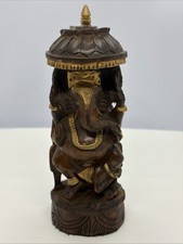 Vintage wooden Lord Ganesha idols umbrella and gold accents picture