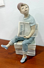 Lladro NAO Paperboy, Boy Sitting on Pile of Newspapers Diario Figurine No Box  picture